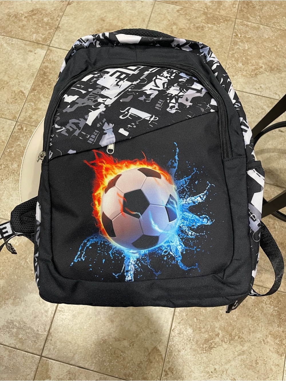 (4) Black Soccer Graphic Men's Backpack with Flame & Water Design